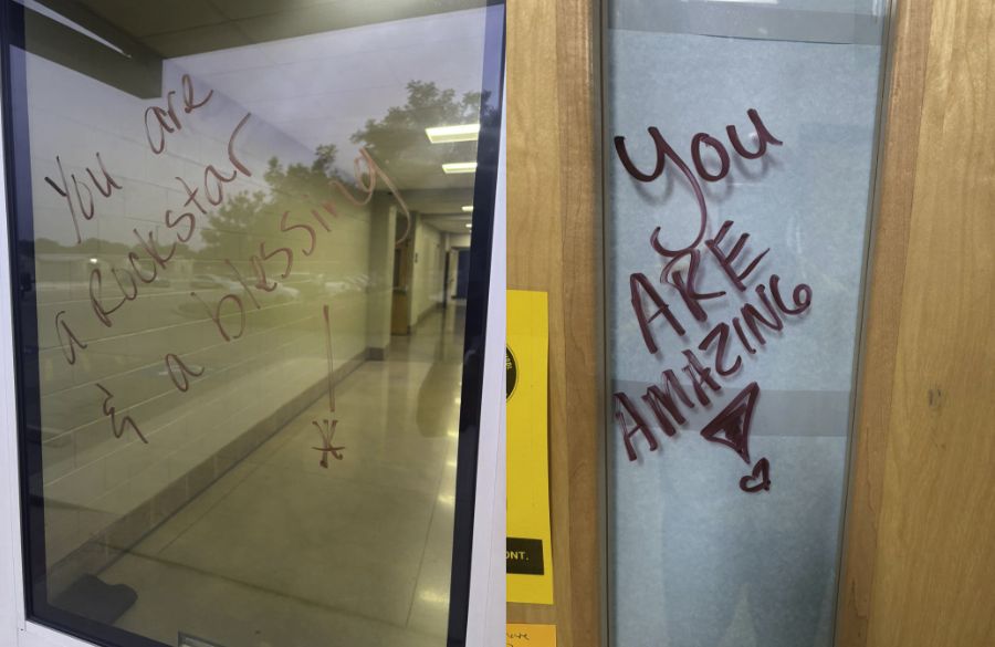 door windows leading to hallways & classrooms are decorated with hand-written messages of positivity.: "you are a rockstar & a blessing!" and "you are amazing!"