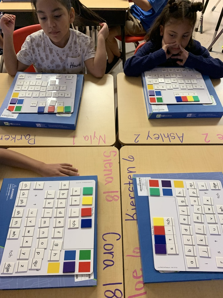 students working on building words
