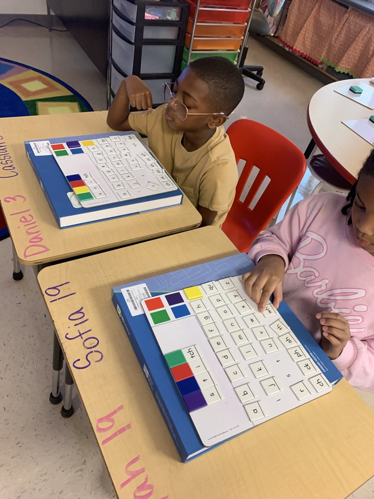 students working on building words