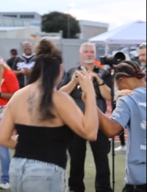 Malanie Reels is congratulated after her $2,000 kick