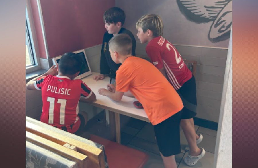 Wilder boys playing games at McDonalds