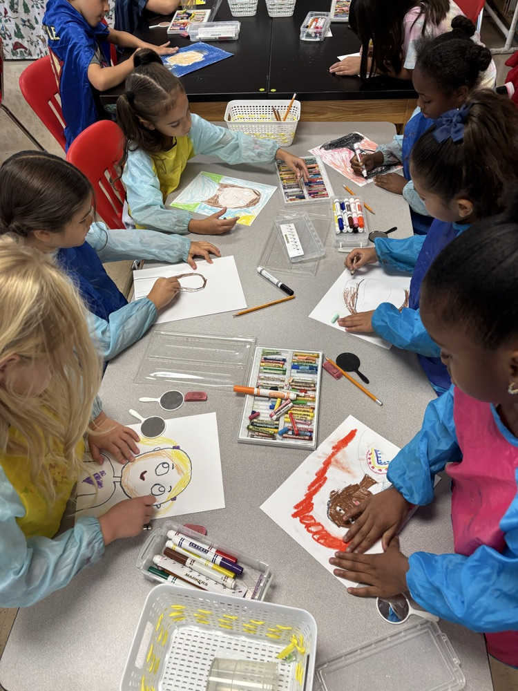 students creating self portraits in art class