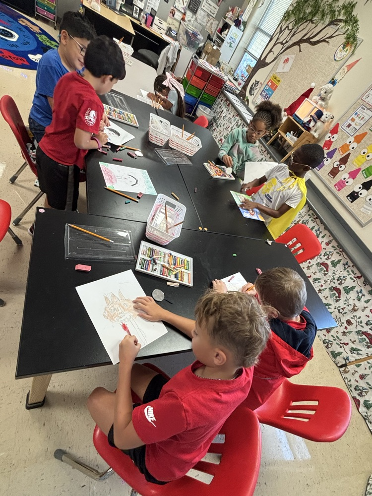 students creating self portraits in art class