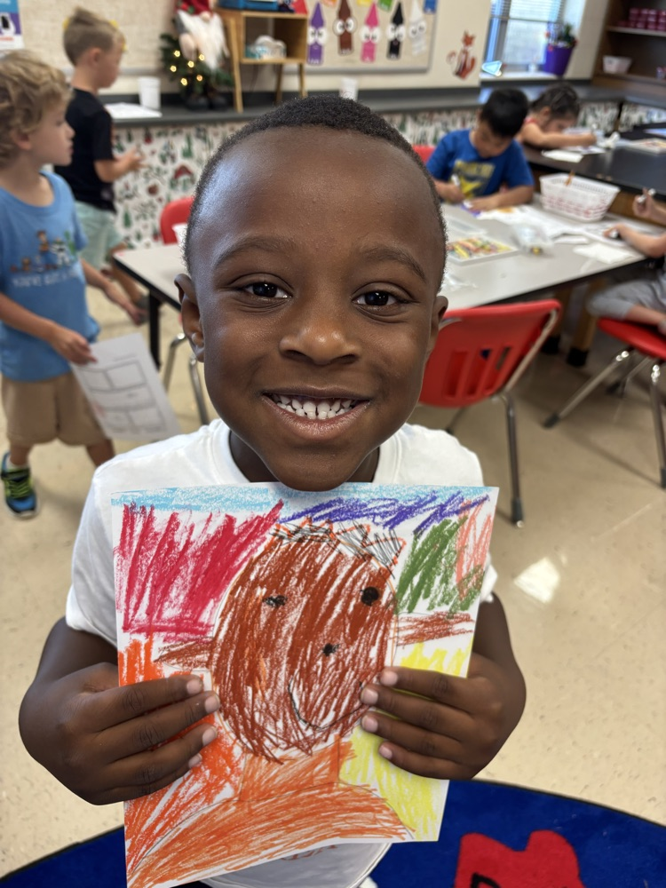 students creating self portraits in art class