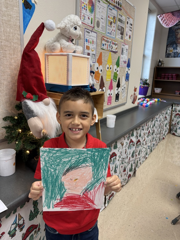 students creating self portraits in art class