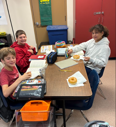 5th graders eating donuts