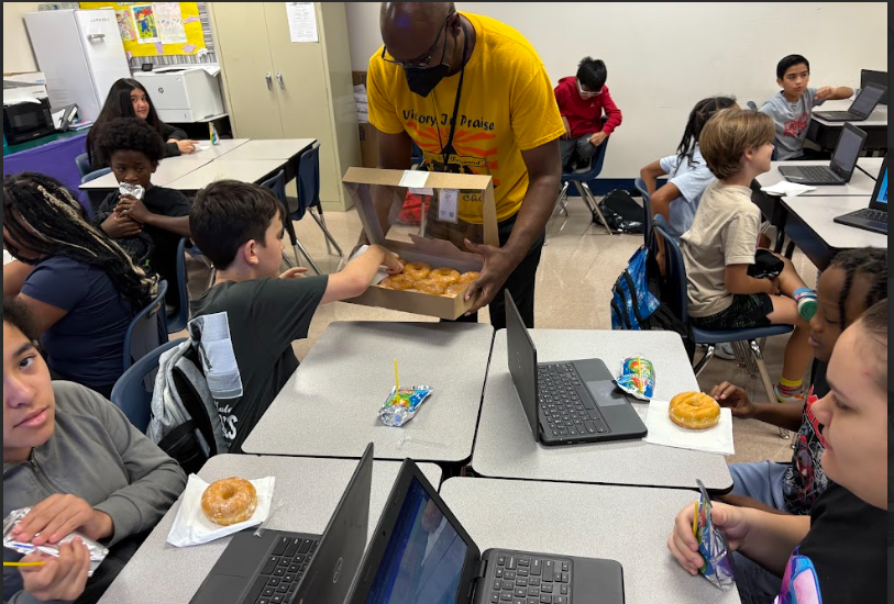 Mr. Smith's class eating donuts
