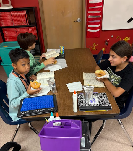 students eating donuts