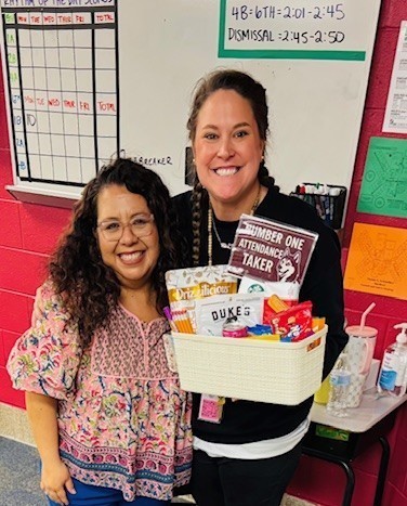 Alvarado with mrs adams and the gift bag