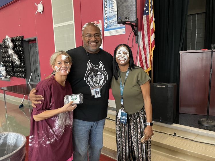 miss Housley, Mr. Butler posing with pie in their face
