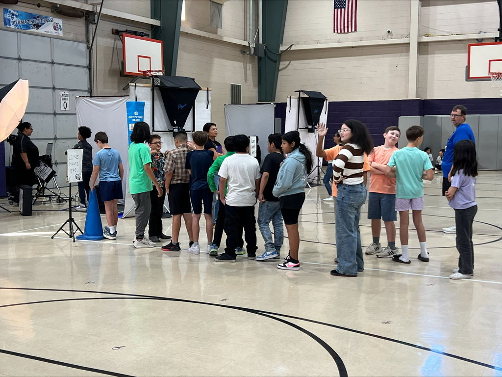 Students waiting in line to take their school picture.