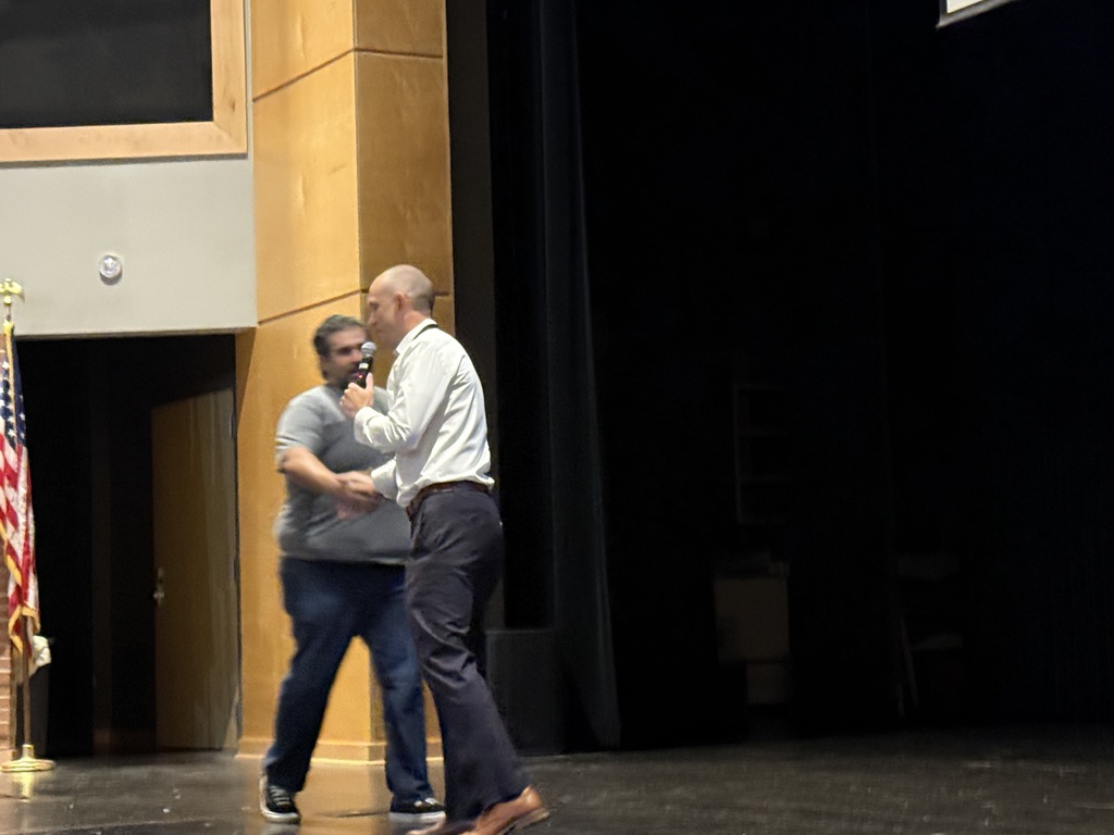 Eric Botello greeted by Steele HS principal Justin Linthicum