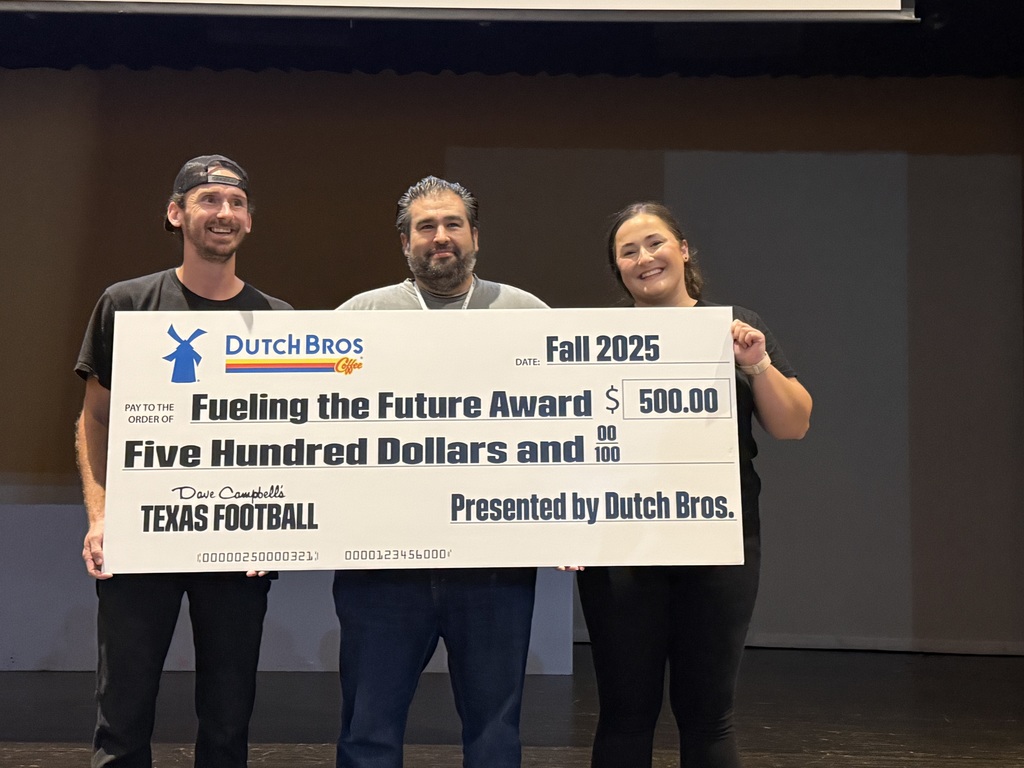 Steele HS is awarded a $500 check.