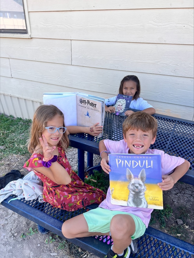 Students reading outdoors