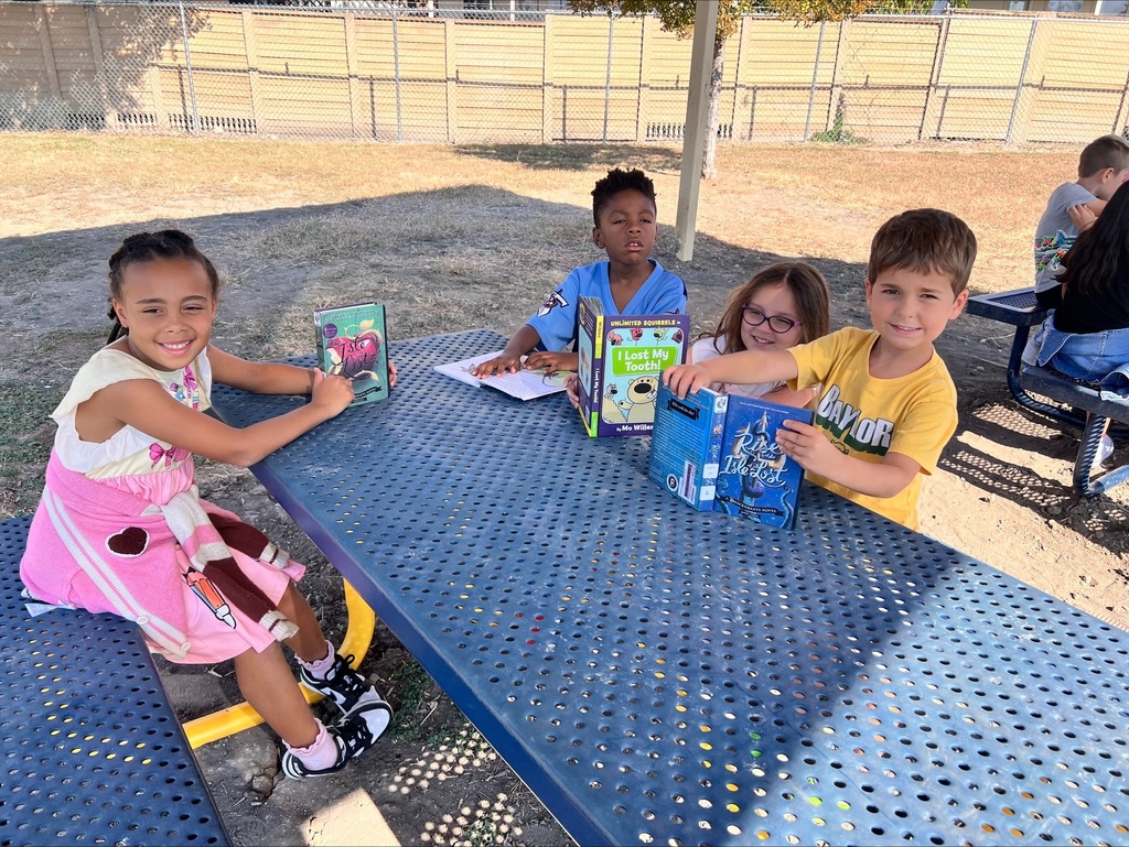 Students reading outdoors