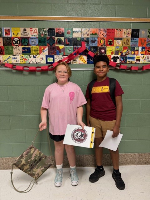 One of our awesome Huskie Ambassadors giving a big welcome to our newest Huskie at Schlather! 