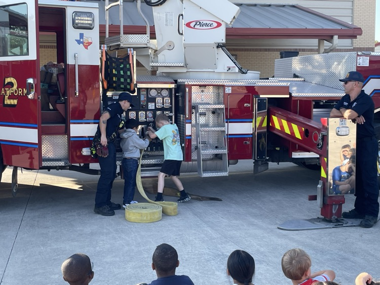 students watching firefighter presentation