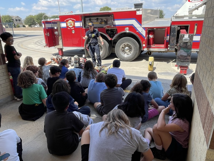 students watching firefighter presentation