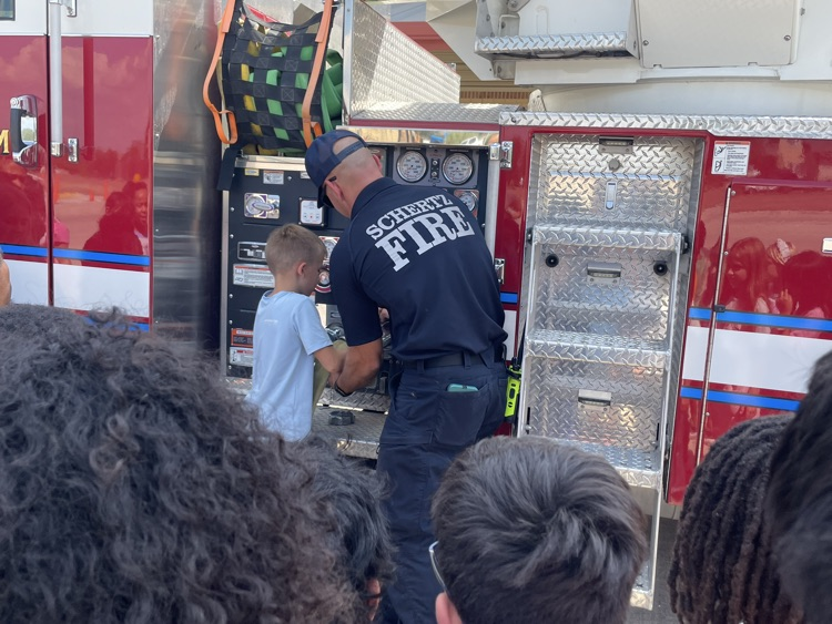 students watching firefighter presentation
