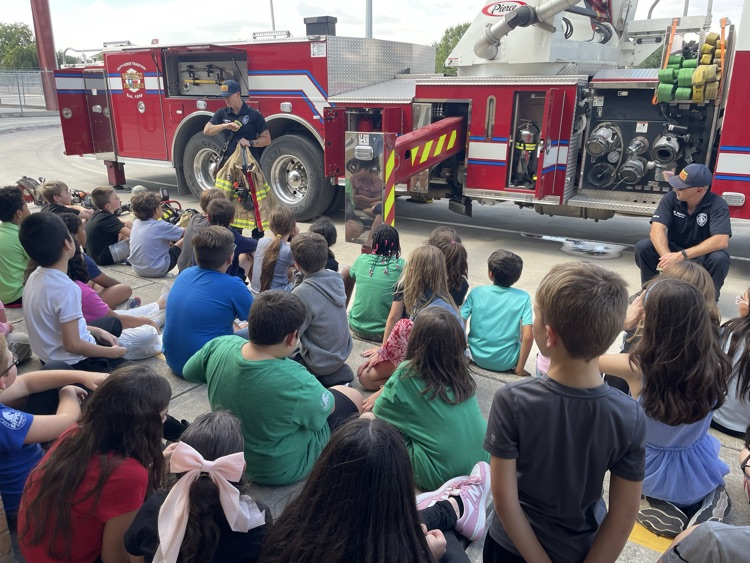 students watching firefighter presentation