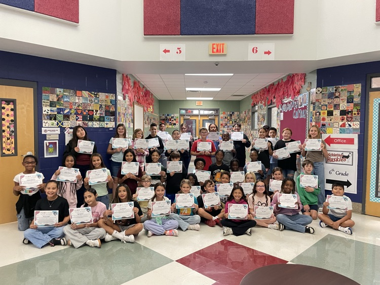 group of students in the foyer with their kindness awards