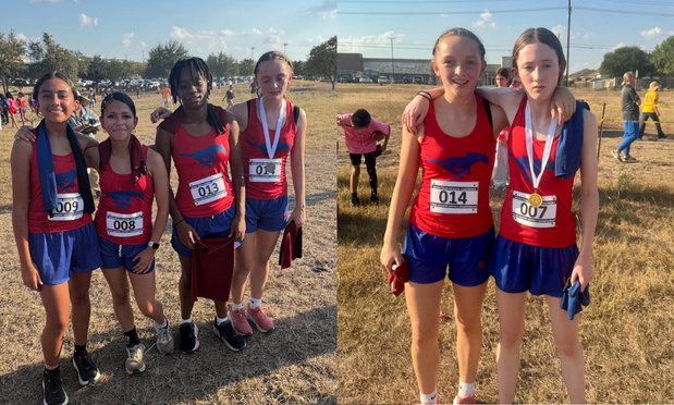 A group of cross country athletes at a meet, some wearing their medals