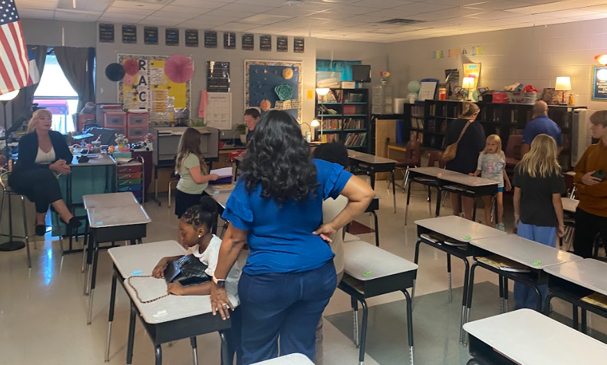 Mrs. Jackson talking with parents