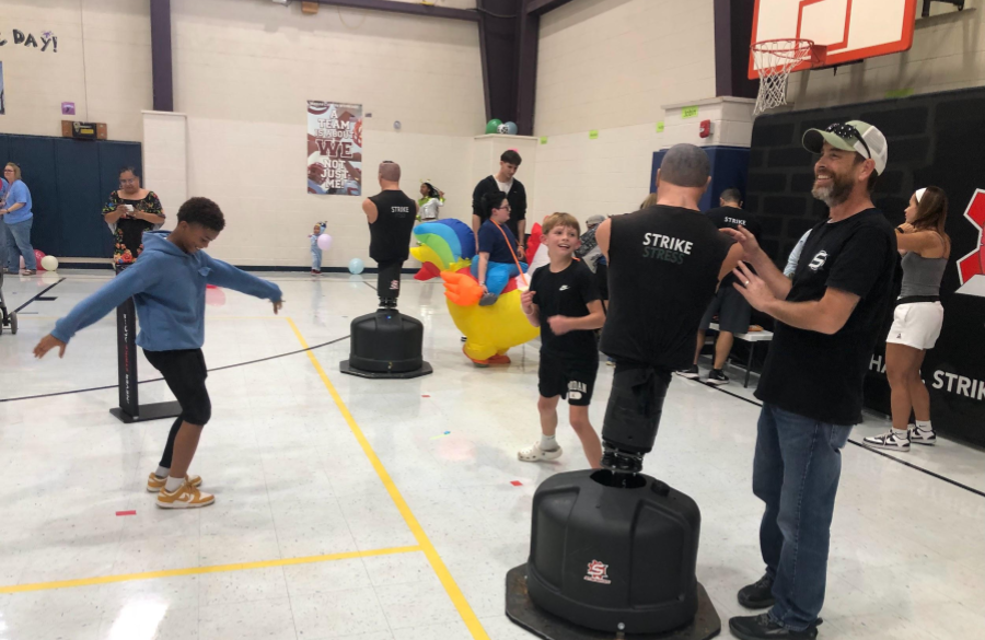 picture of students and their families enjoying the fall festival