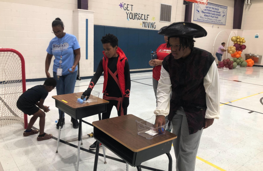 picture of students and their families enjoying the fall festival