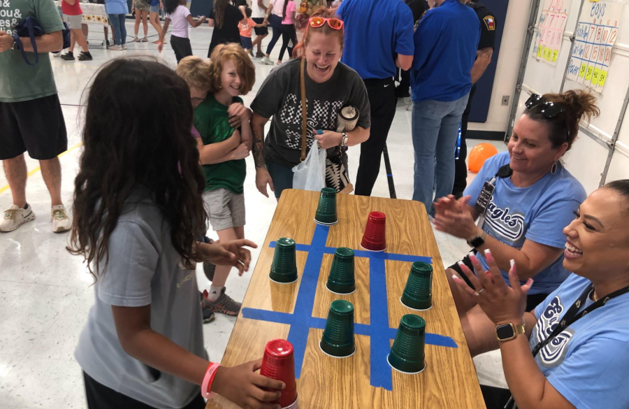 picture of students and their families enjoying the fall festival