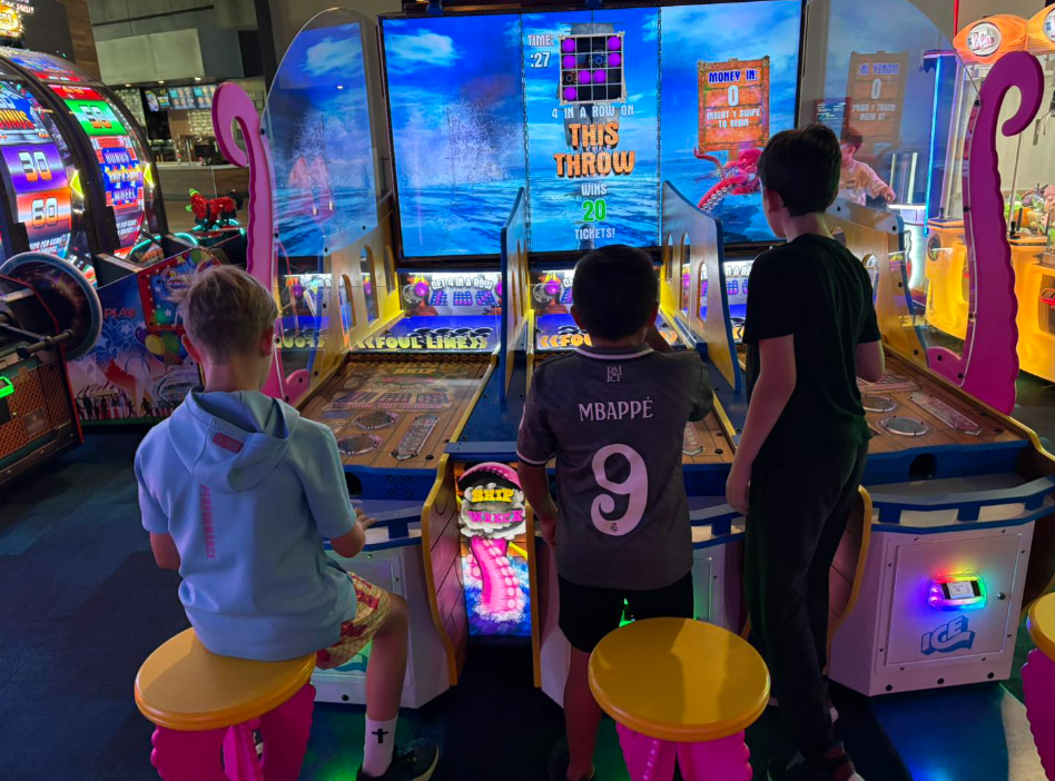 Wilder boys playing arcade games