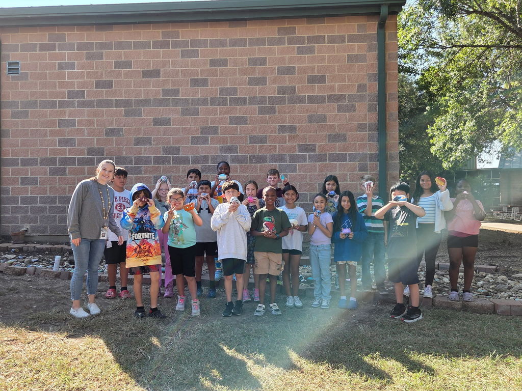 Wildcats adding their rock paintings to the courtyard