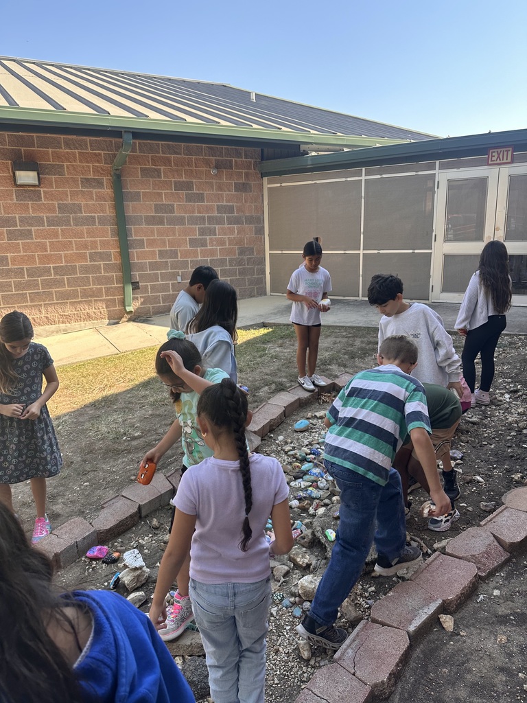 Wildcats adding their rock paintings to the courtyard