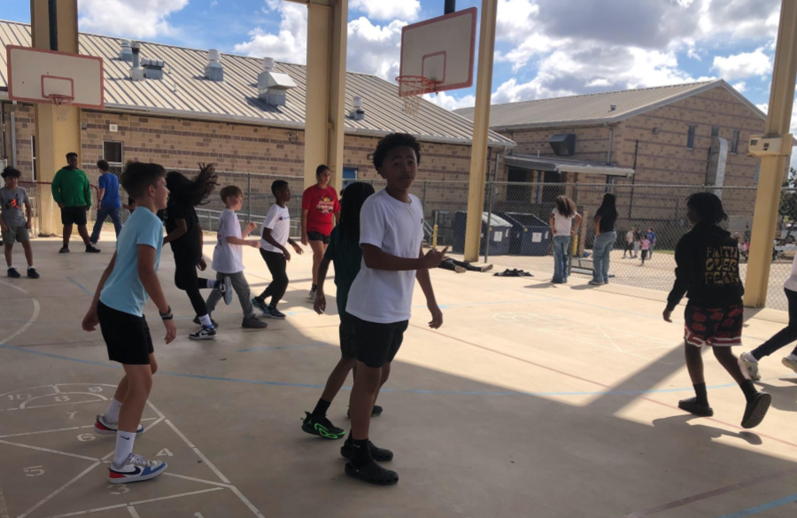 picture of students playing basketball at recess