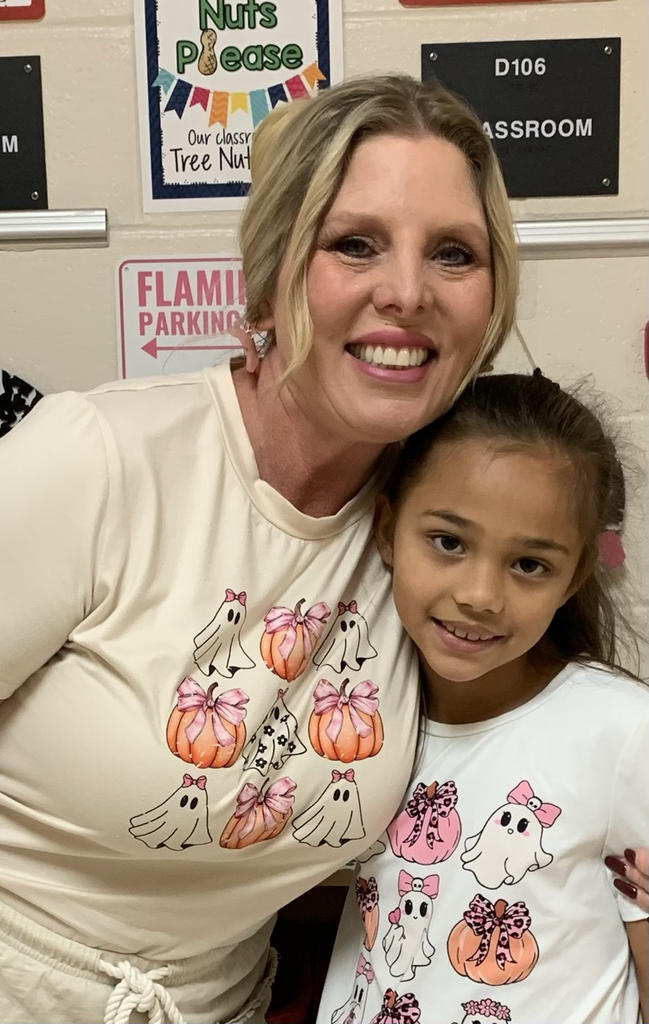 Student and teacher in matching Halloween shirts
