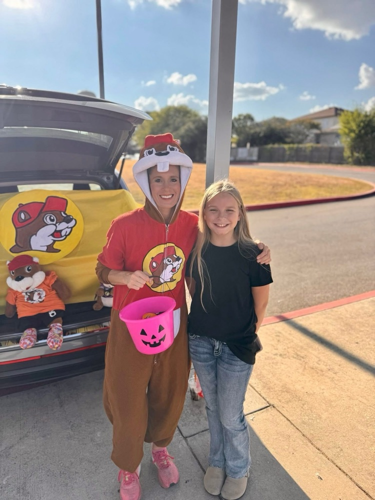 Housley posing with a student