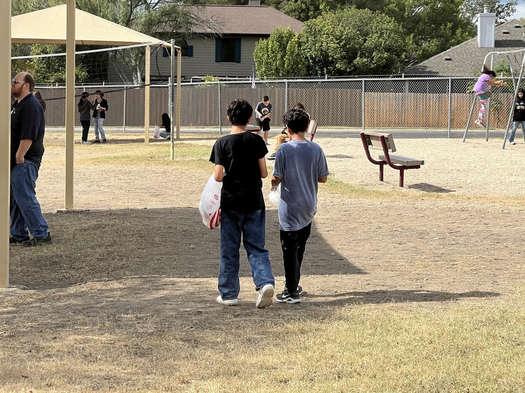 two boys walking at recess