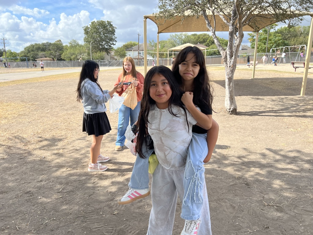 two 6th grade girls on piggy back