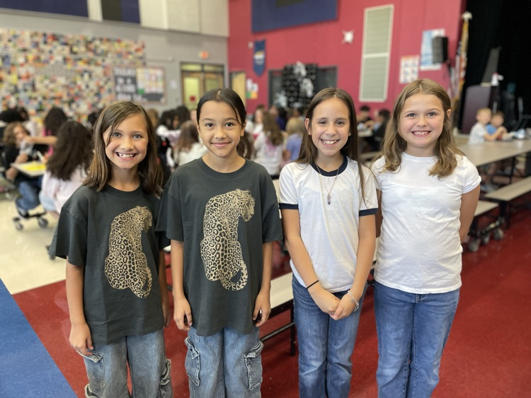 two sets of twins posing in the