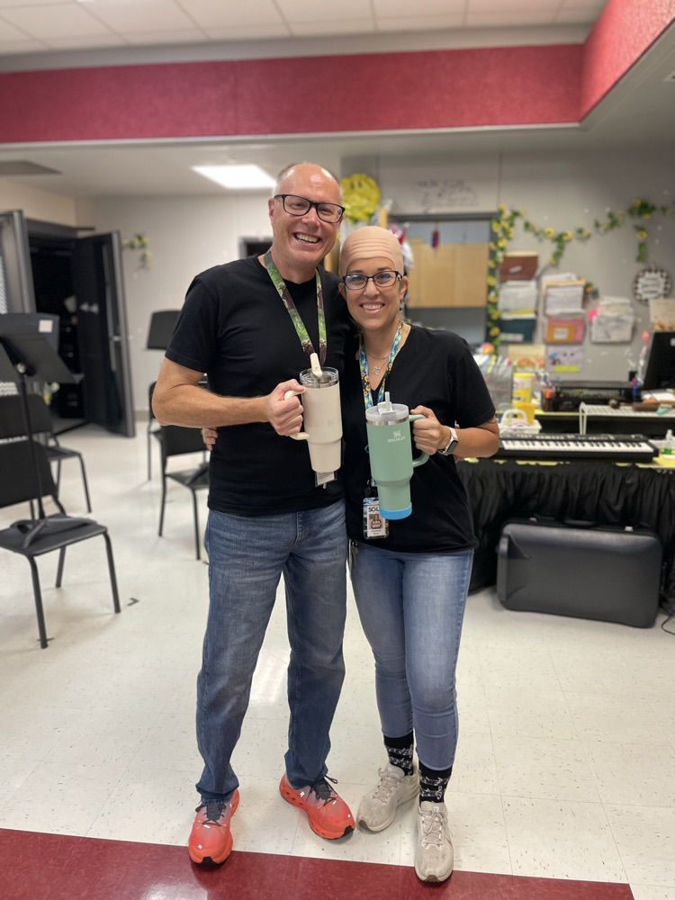 Both band directors posing as twins
