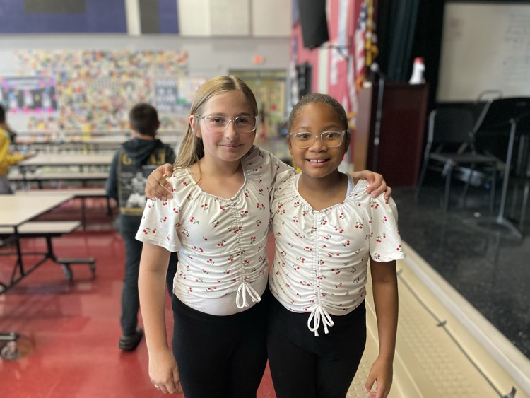 Two girls posing as twins in the