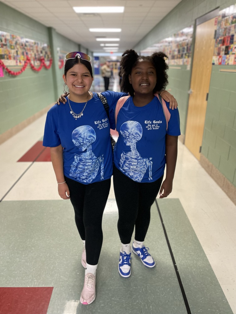 Two girls posing as twins in the