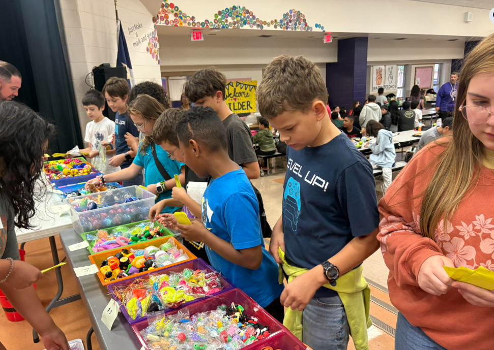 students deciding what to buy at school store