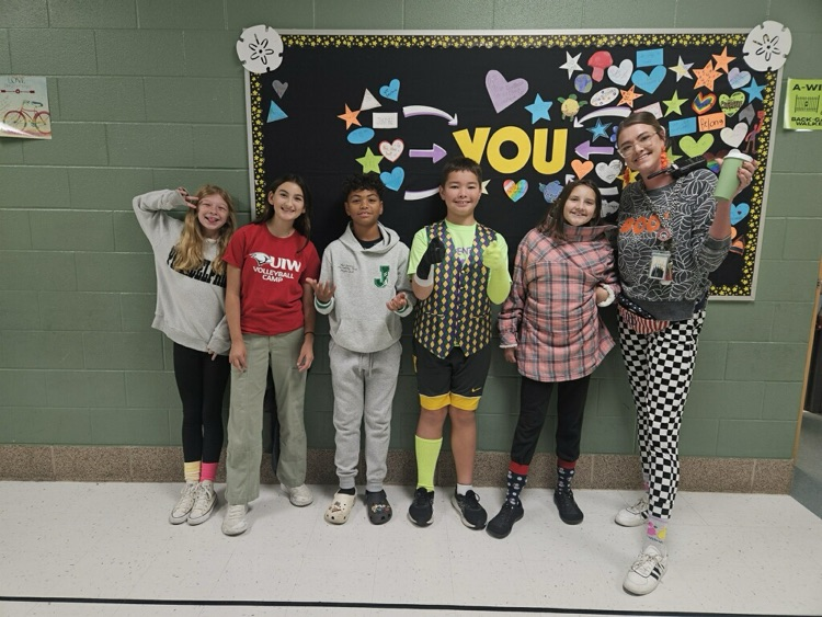 five students in the hallway with Miss Stoli just in wacky wear