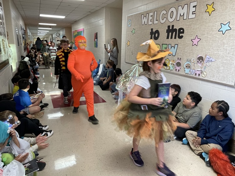 Sippel character parade with students and teachers dressed up 