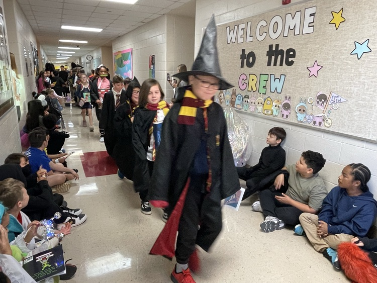 Sippel character parade with students and teachers dressed up 