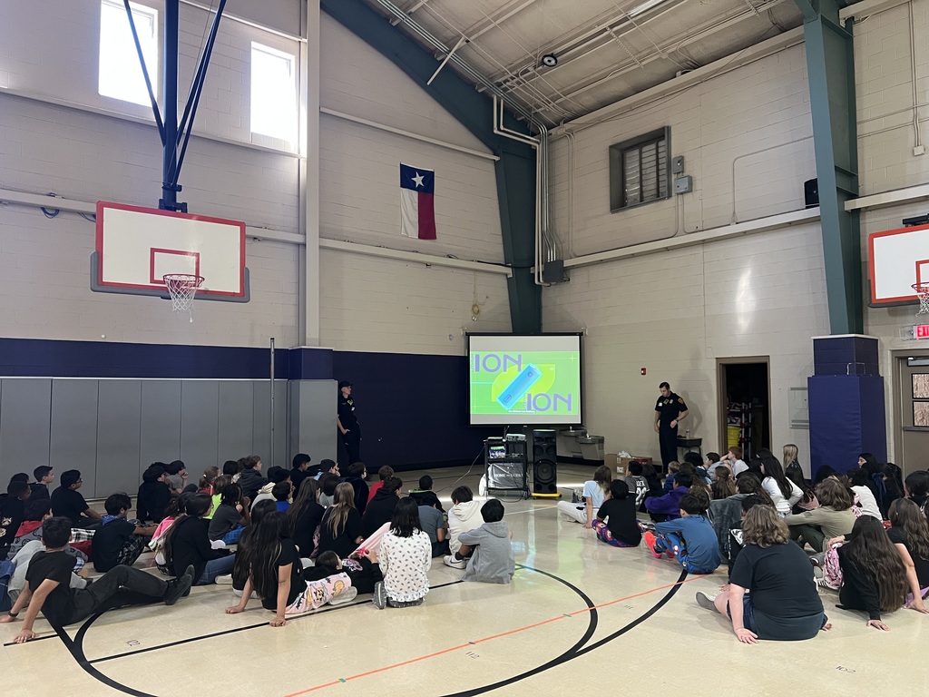 students in gym with firefighters