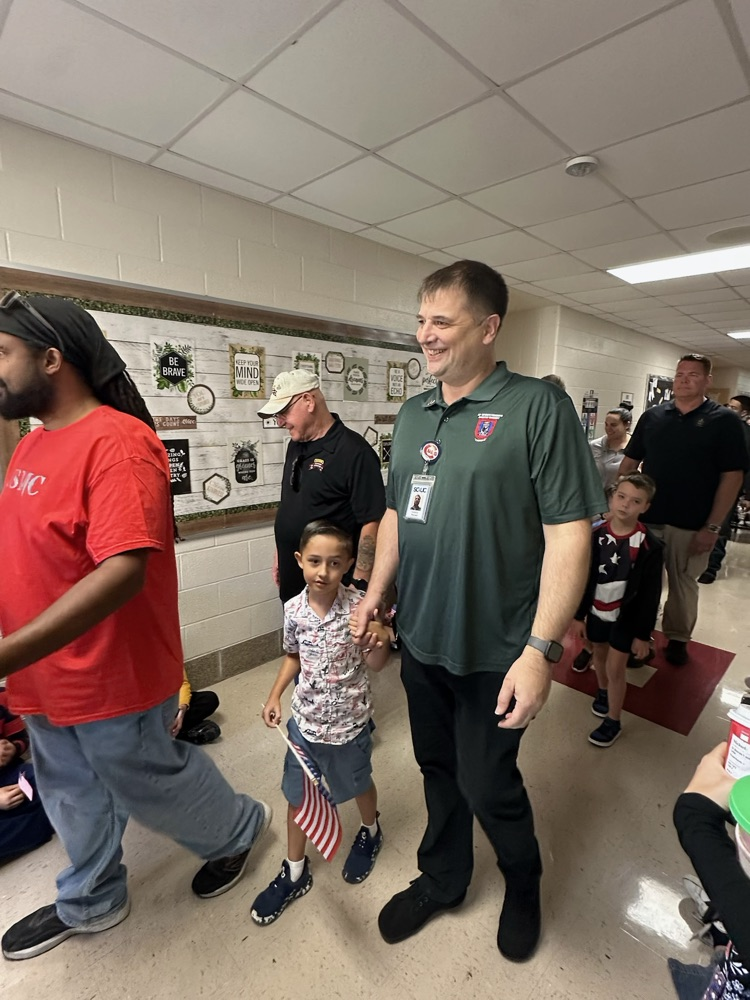 veteran parents and students walking the halls