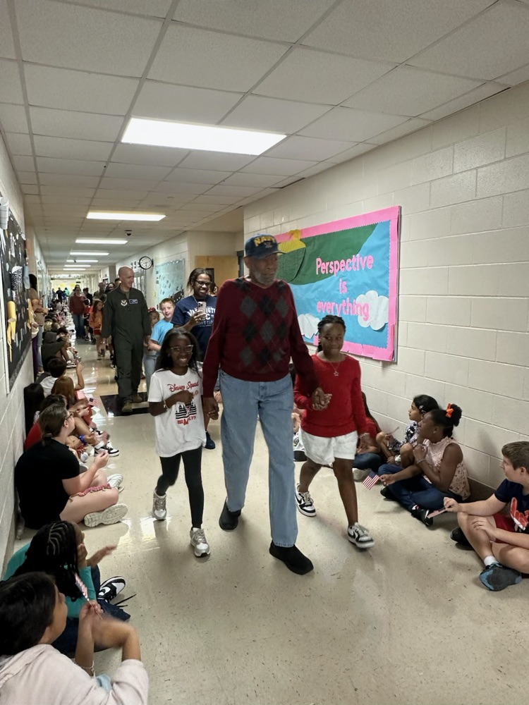 veteran parents and students walking the halls
