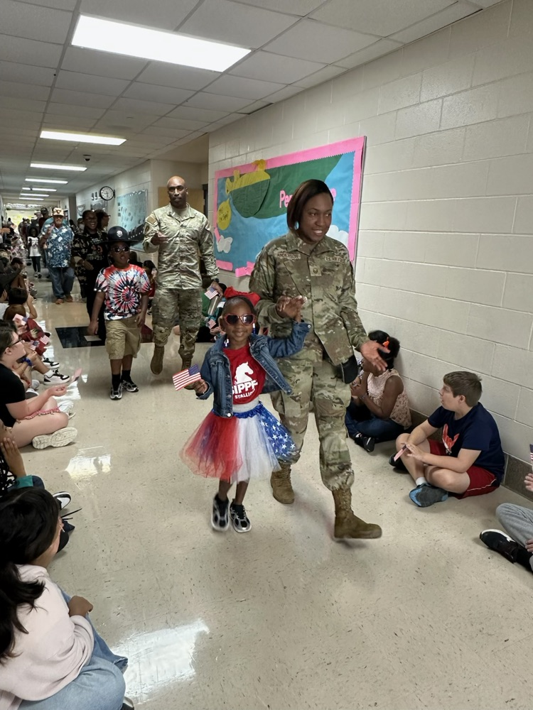 veteran parents and students walking the halls